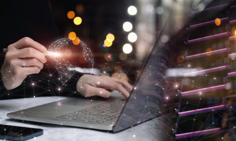 A businessman at a laptop works in the global Internet network.